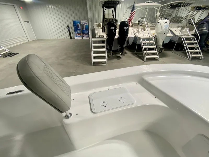 Slide: The Image of 2024 Savannah SS21 boat interior with seating and storage compartments in a showroom. - 20