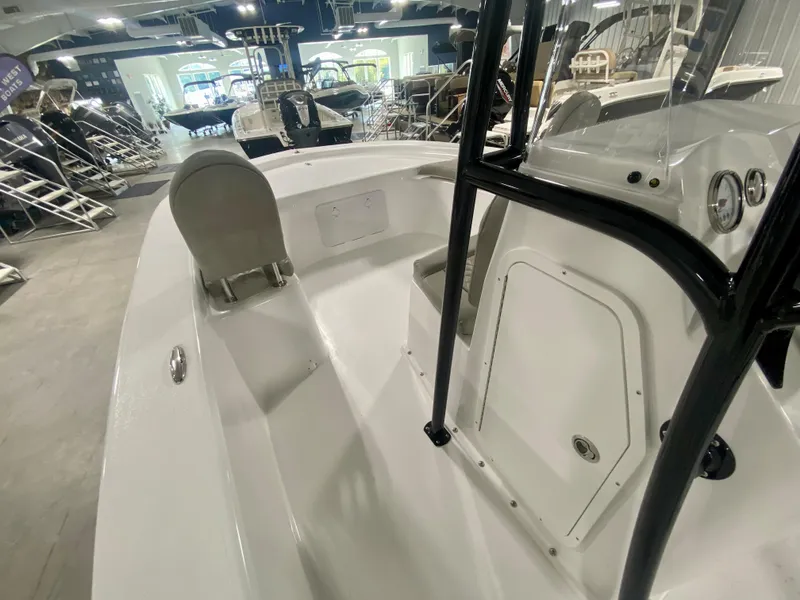 Slide: The Image of 2024 Savannah SS21 boat interior at a showroom, featuring seating and control panel. - 26