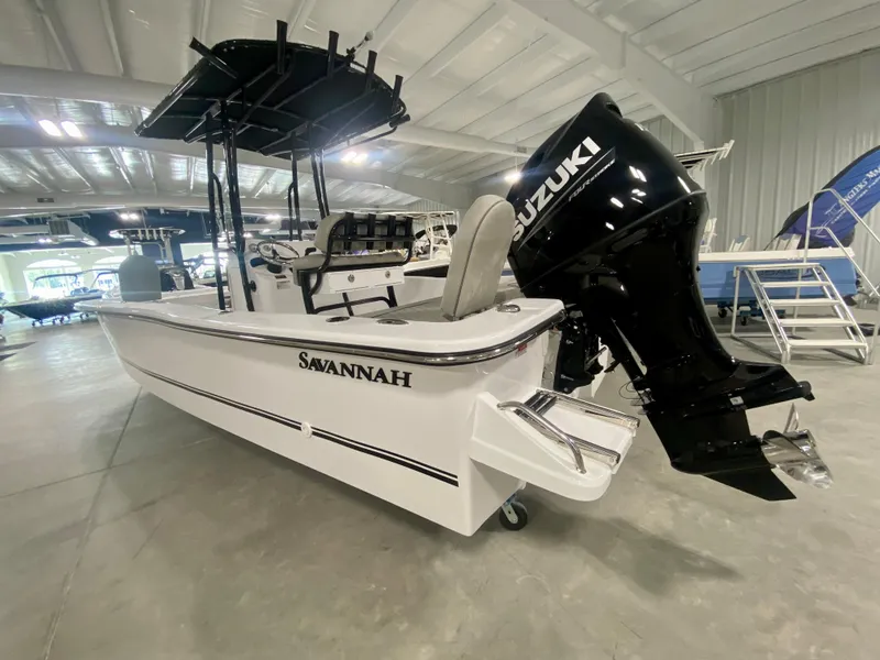 Slide: The Image of 2024 Savannah SS21 boat with Suzuki outboard motor in showroom. - 5