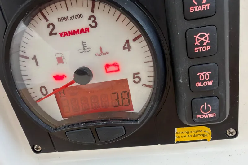 Slide: The Image of Yanmar engine control panel on 2025 J Boats J/9 sailboat, displaying RPM and warning lights. - 14