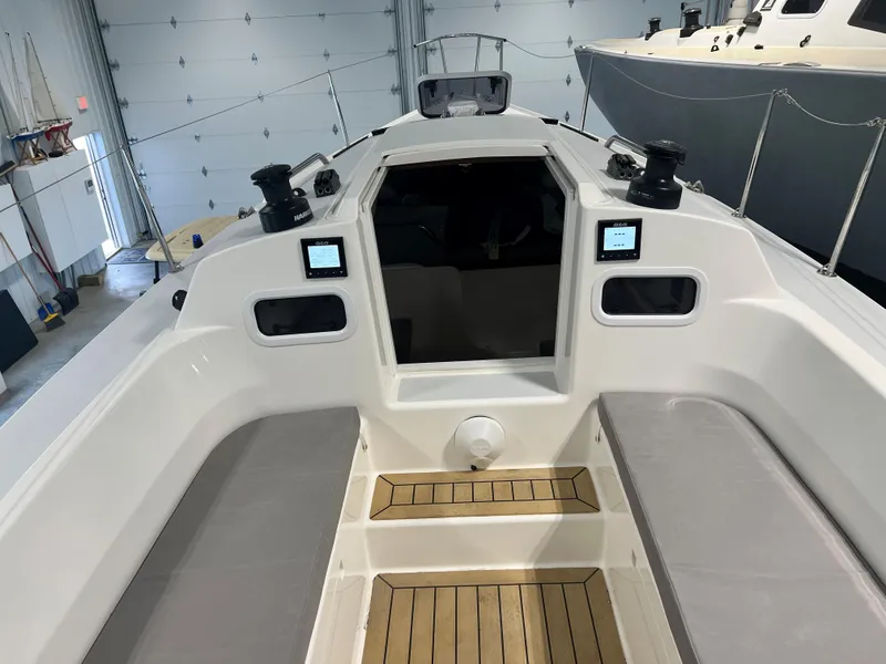 Slide: The Image of 2024 J Boats J/9 sailboat cockpit with cushioned seating and modern controls. - 5