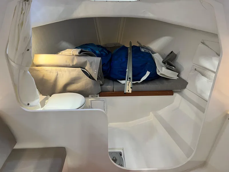 Slide: The Image of 2024 J Boats J/9 cabin interior with storage and seating. - 8