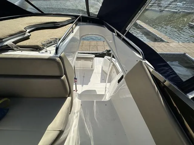 Slide: The Image of 2010 Regal 4080 Flybridge interior with seating and water view. - 15