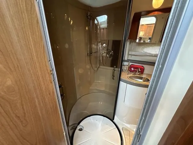 Slide: The Image of Bathroom interior of a 2010 Regal 4080 Flybridge yacht with shower and sink. - 5
