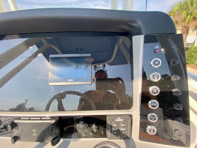 Slide: The Image of Dashboard of 2024 Robalo R232 Explorer boat with control panel and display screen. - 13