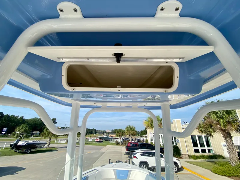 Slide: The Image of 2024 Robalo R232 Explorer boat with T-top storage compartment. - 18
