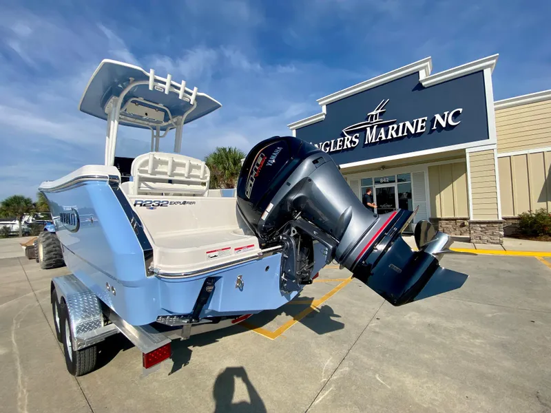 Slide: The Image of 2024 Robalo R232 Explorer boat at Angler's Marine NC dealership. - 2