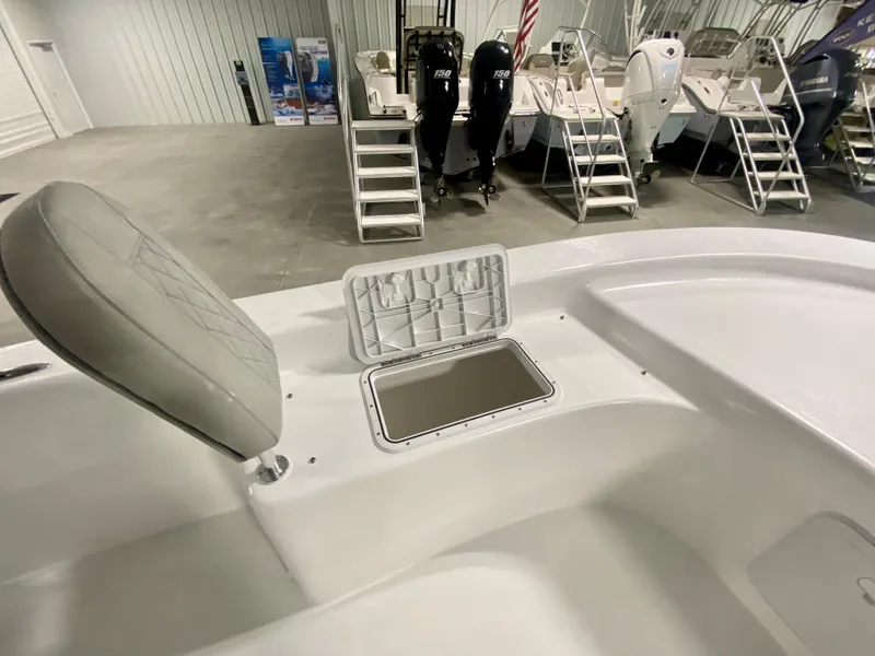 Slide: The Image of 2024 Savannah SS21 boat interior with open storage compartment in showroom. - 21
