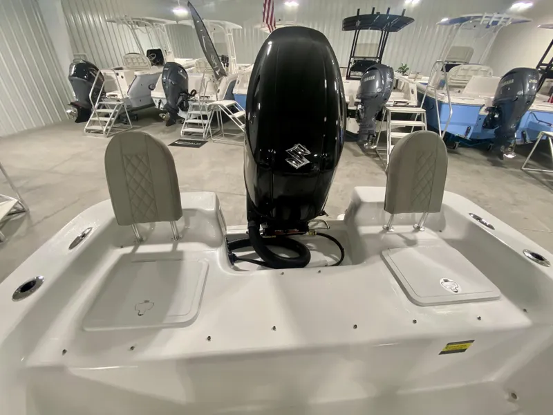 Slide: The Image of 2024 Savannah SS21 boat with outboard motor in showroom. - 7