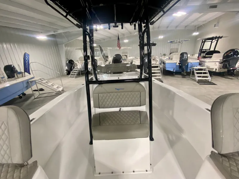 Slide: The Image of 2024 Savannah SS21 boat interior with seating, displayed in a showroom. - 16