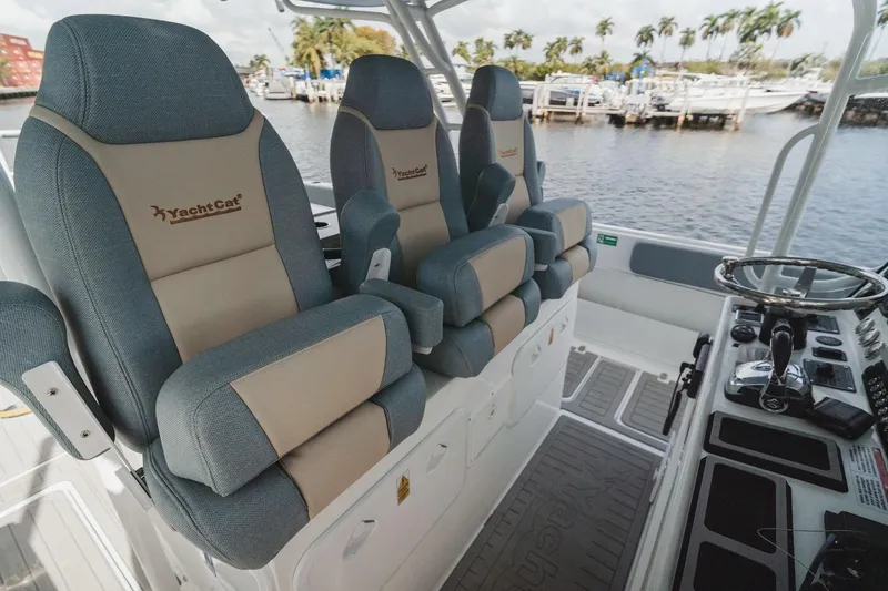 Slide: The Image of Luxury seating on 2024 YachtCat 41, featuring ergonomic design and waterfront view. - 11
