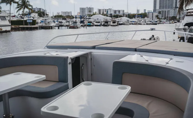 Slide: The Image of Luxury YachtCat 41 (2024) interior with marina view, featuring elegant seating and tables. - 15