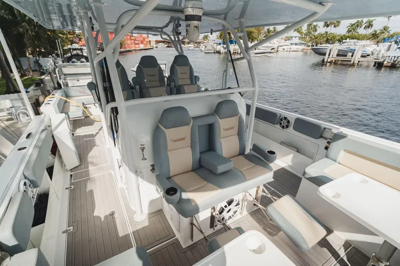 Slide: The Image of Luxurious 2024 YachtCat 41 interior with plush seating and modern design by the waterfront. - 16
