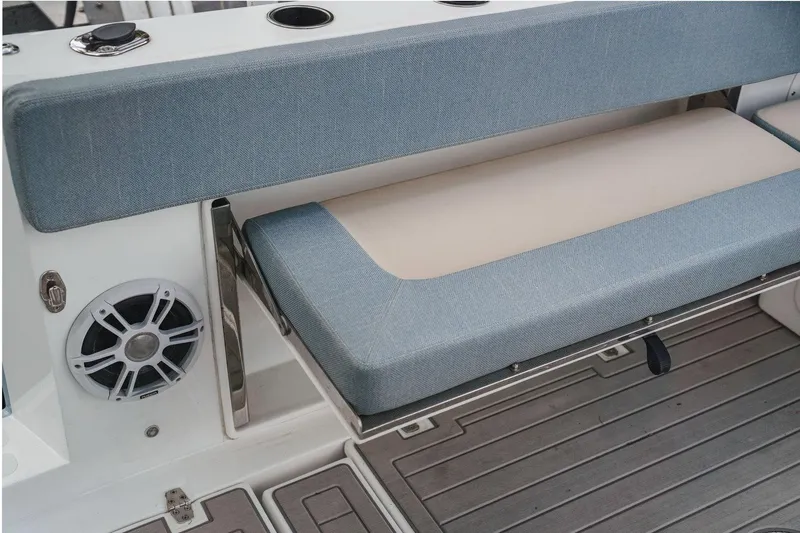 Slide: The Image of YachtCat 41 (2024) seating area with blue cushions and integrated speaker. - 20