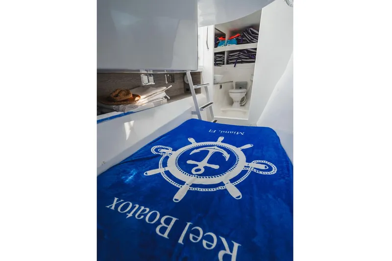 Slide: The Image of Luxurious 2024 YachtCat 41 interior with cozy cabin and modern bathroom. - 25