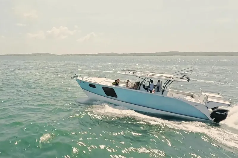 Slide: The Image of 2024 YachtCat 41 cruising on open water with passengers enjoying the ride. - 3