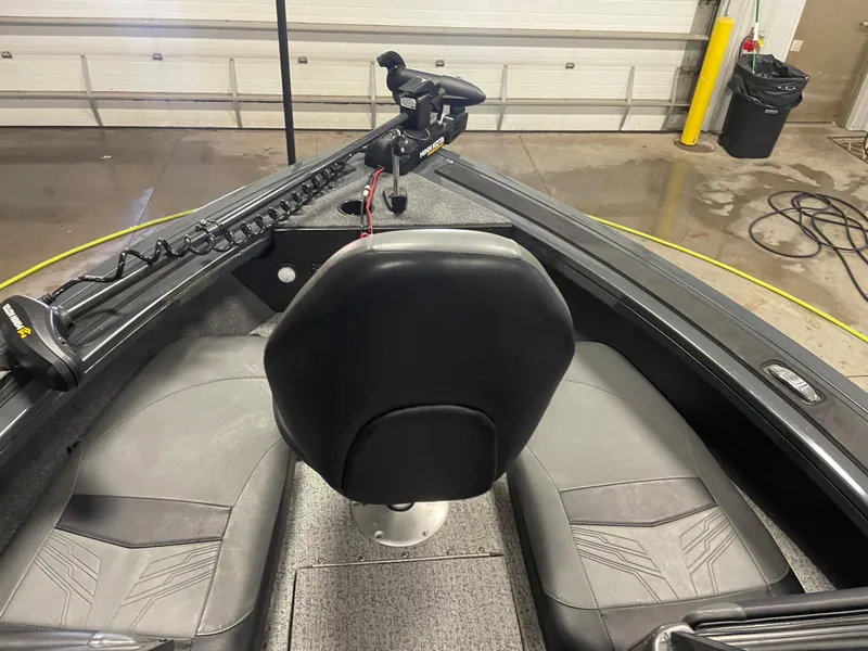 Slide: The Image of 2021 Tracker Targa V-18 WT boat interior with seating and control panel. - 12