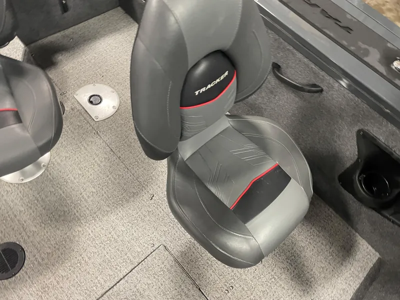 Slide: The Image of 2021 Tracker Targa V-18 WT boat interior with gray and black seating. - 8