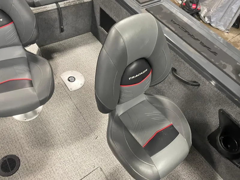 Slide: The Image of 2021 Tracker Targa V-18 WT boat interior with gray and black seats. - 9