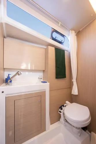 Slide: The Image of 2025 Beneteau Oceanis 37.1 yacht bathroom with modern fixtures and natural lighting. - 17