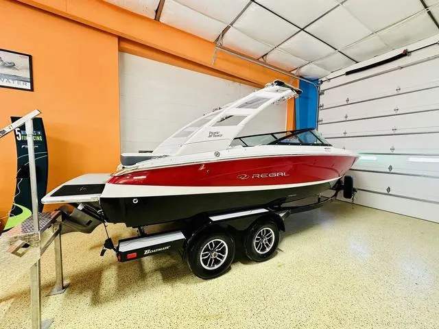 Slide: The Image of 2024 Regal LS2 boat on trailer in indoor showroom. - 3