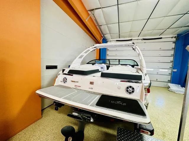 Slide: The Image of 2024 Regal LS2 boat in a garage, rear view. - 7