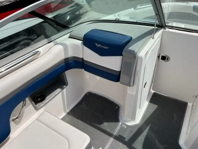 Slide: The Image of 2015 Chaparral 203VR boat interior with blue and white seating. - 12