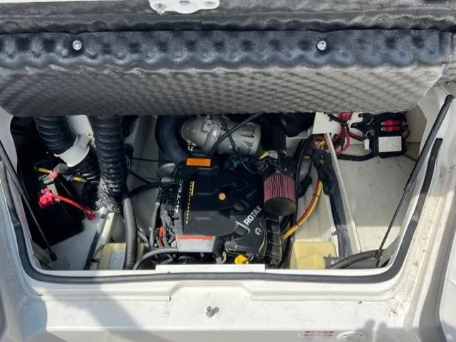 Slide: The Image of Engine compartment of a 2015 Chaparral 203VR boat, featuring a Rotax engine. - 14