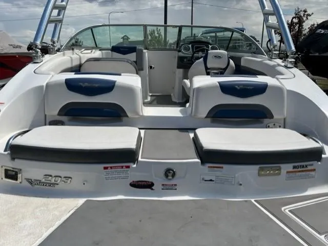 Slide: The Image of 2015 Chaparral 203VR boat interior with seating and dashboard view. - 15