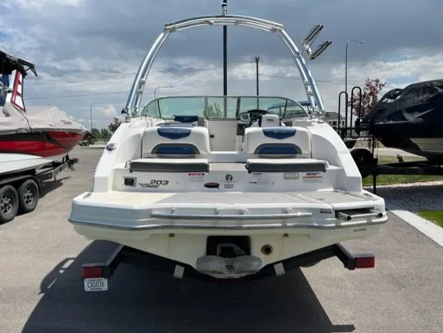 Slide: The Image of 2015 Chaparral 203VR boat, rear view, parked outdoors on a sunny day. - 6