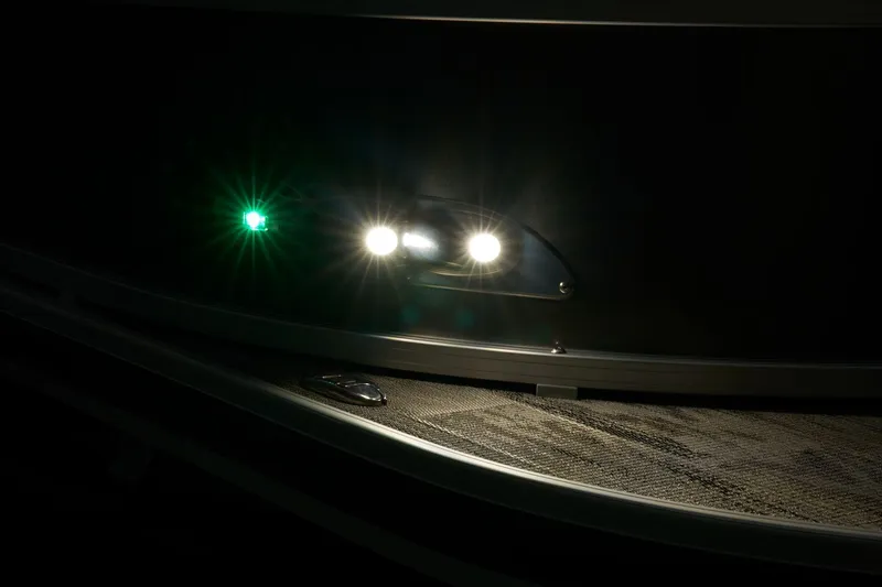 Slide: The Image of 2024 Ranger Reata 223C boat navigation lights at night. - 12