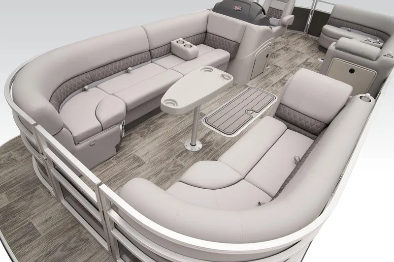 Slide: The Image of 2024 Ranger Reata 223C pontoon boat interior with plush seating and table. - 15
