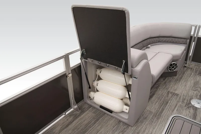 Slide: The Image of 2024 Ranger Reata 223C boat with open storage compartment and seating. - 24