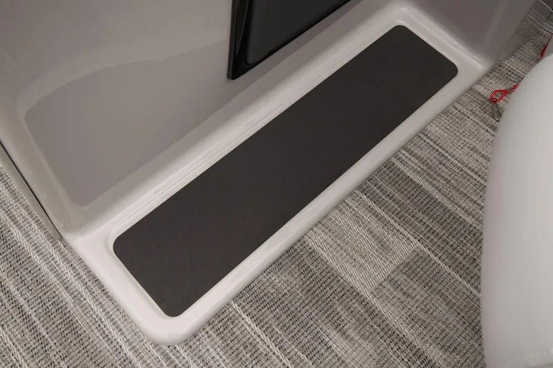 Slide: The Image of 2024 Ranger Reata 223C boat interior step with non-slip mat. - 30