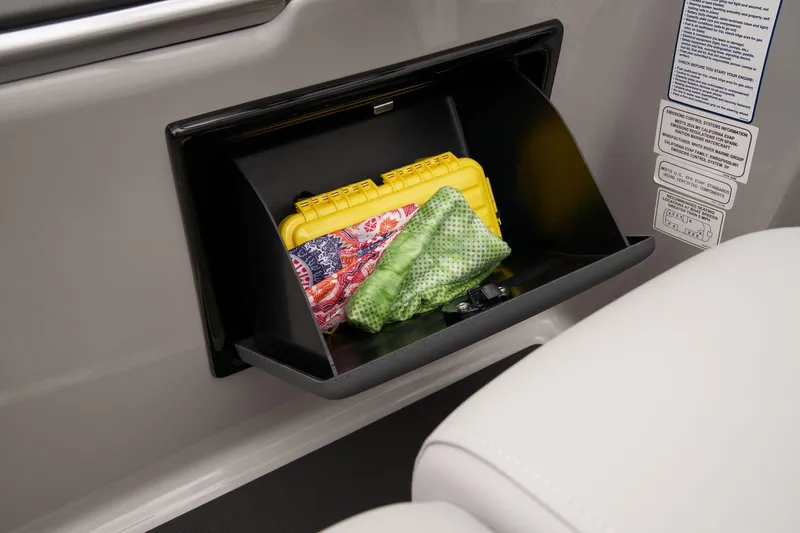 Slide: The Image of Storage compartment in 2024 Ranger Reata 223C boat with items inside. - 41