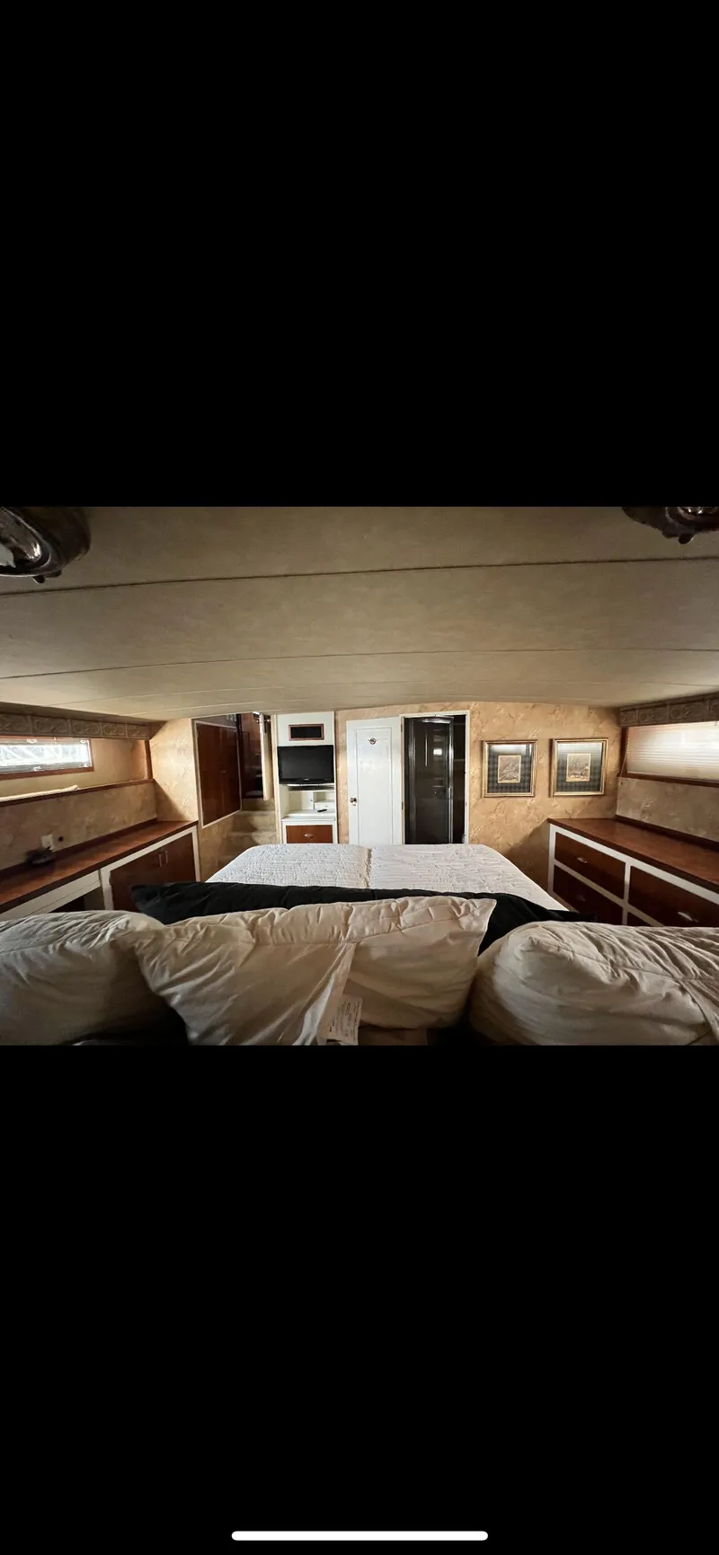 Slide: The Image of Interior cabin of a 1982 Bertram 58 Fly yacht with cozy bedding. - 16