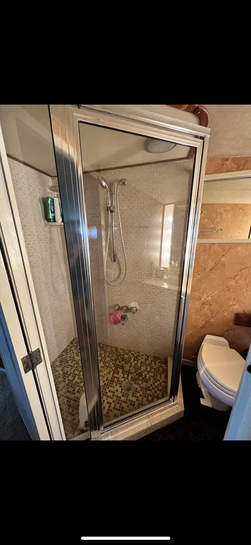 Slide: The Image of 1982 Bertram 58 Fly bathroom with shower and toilet. - 18
