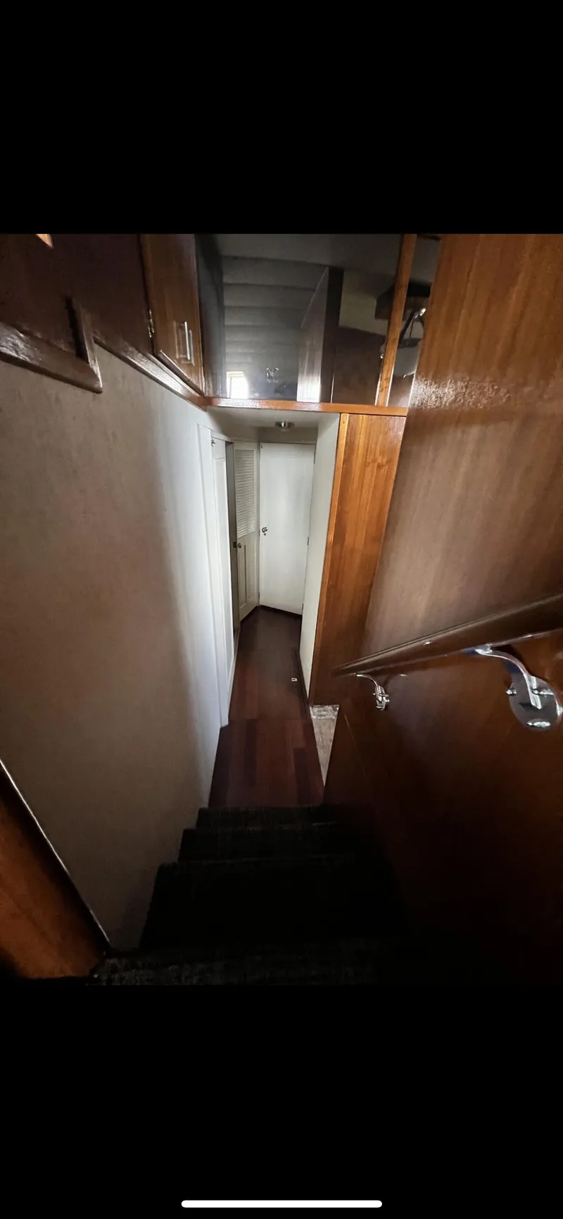 Slide: The Image of Interior stairway of a 1982 Bertram 58 Fly yacht. - 19
