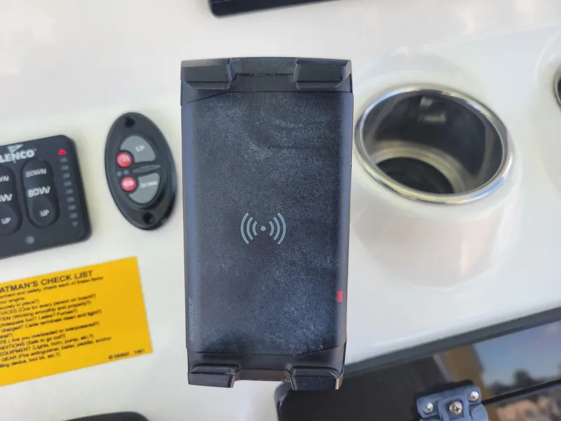Slide: The Image of Control panel of a 2018 Key West 281 Billistic boat with wireless charging pad. - 13