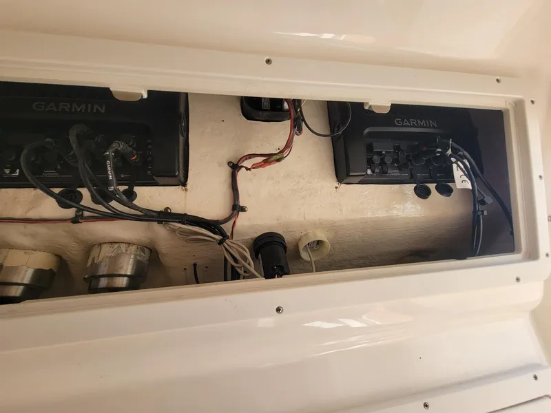 Slide: The Image of 2018 Key West 281 Billistic electronics compartment with Garmin devices and wiring. - 38
