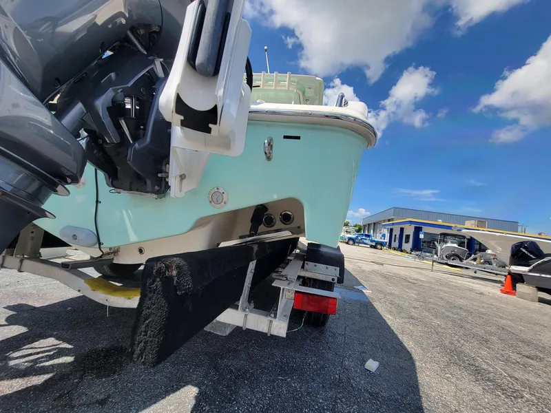 Slide: The Image of 2018 Key West 281 Billistic boat on a trailer in a parking lot. - 49