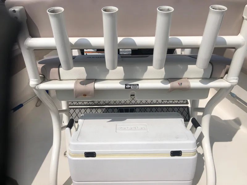 Slide: The Image of 2019 Wellcraft 242 Fisherman boat with rod holders and cooler storage. - 10