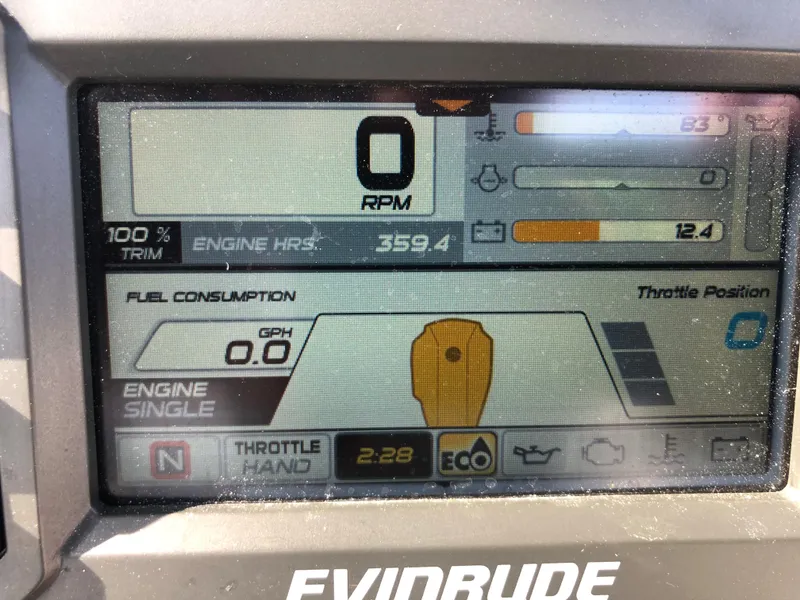 Slide: The Image of Evinrude engine display on a 2019 Wellcraft 242 Fisherman boat showing RPM and fuel consumption. - 19