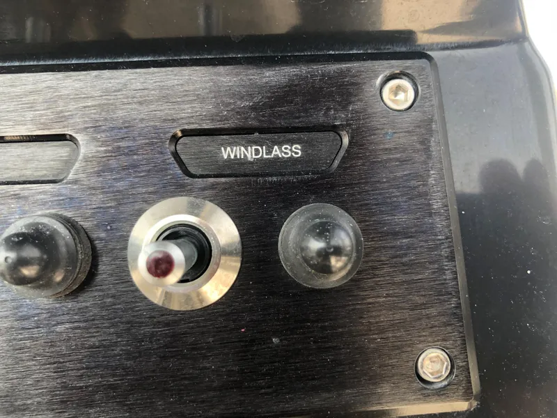 Slide: The Image of Control panel of 2019 Wellcraft 242 Fisherman boat featuring windlass switch. - 20
