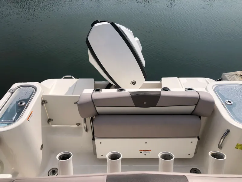 Slide: The Image of 2019 Wellcraft 242 Fisherman boat interior with seating and rod holders. - 29
