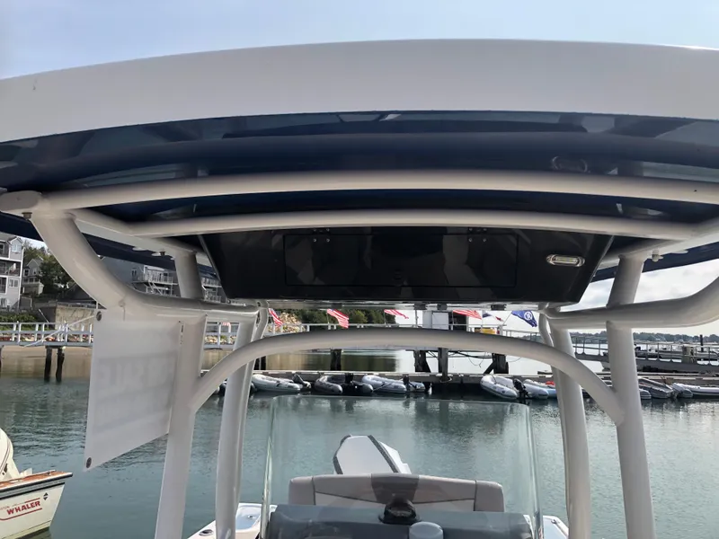 Slide: The Image of 2019 Wellcraft 242 Fisherman boat with T-top, docked at a marina. - 40