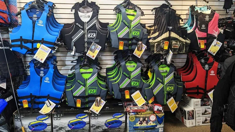 Slide: The Image of Various life jackets on display in a store, including Yamaha and JetPilot brands. - 5