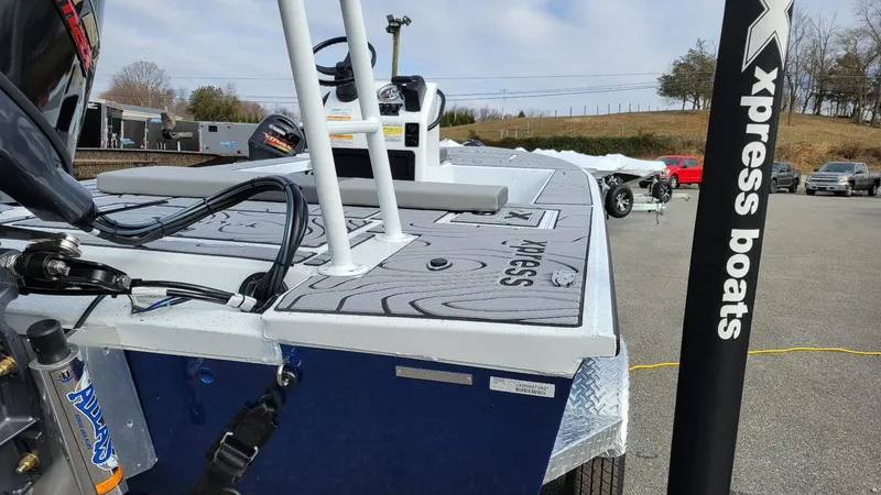 Slide: The Image of 2025 Xpress Skiff 185 with Yamaha Vmax 115 SHO, showcased in a parking lot. - 17