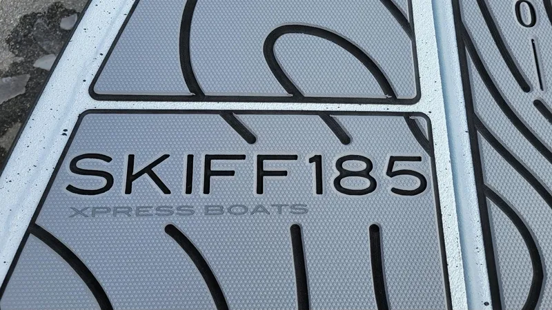 Slide: The Image of Xpress Skiff 185 boat floor detail, showcasing textured design, 2025 model. - 20