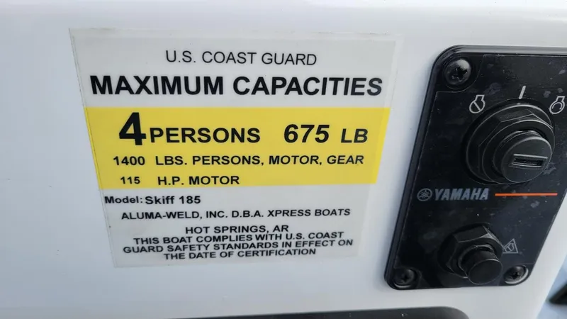 Slide: The Image of U.S. Coast Guard capacity label on 2025 Xpress Skiff 185 with Yamaha Vmax 115 SHO. - 23